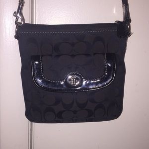 Black cross body coach purse.